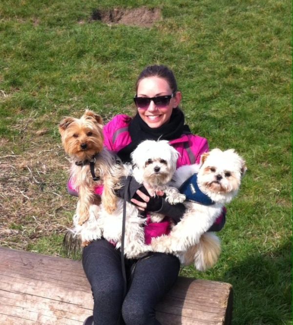 me with 3 very cute little dogs in my arms looking very happy